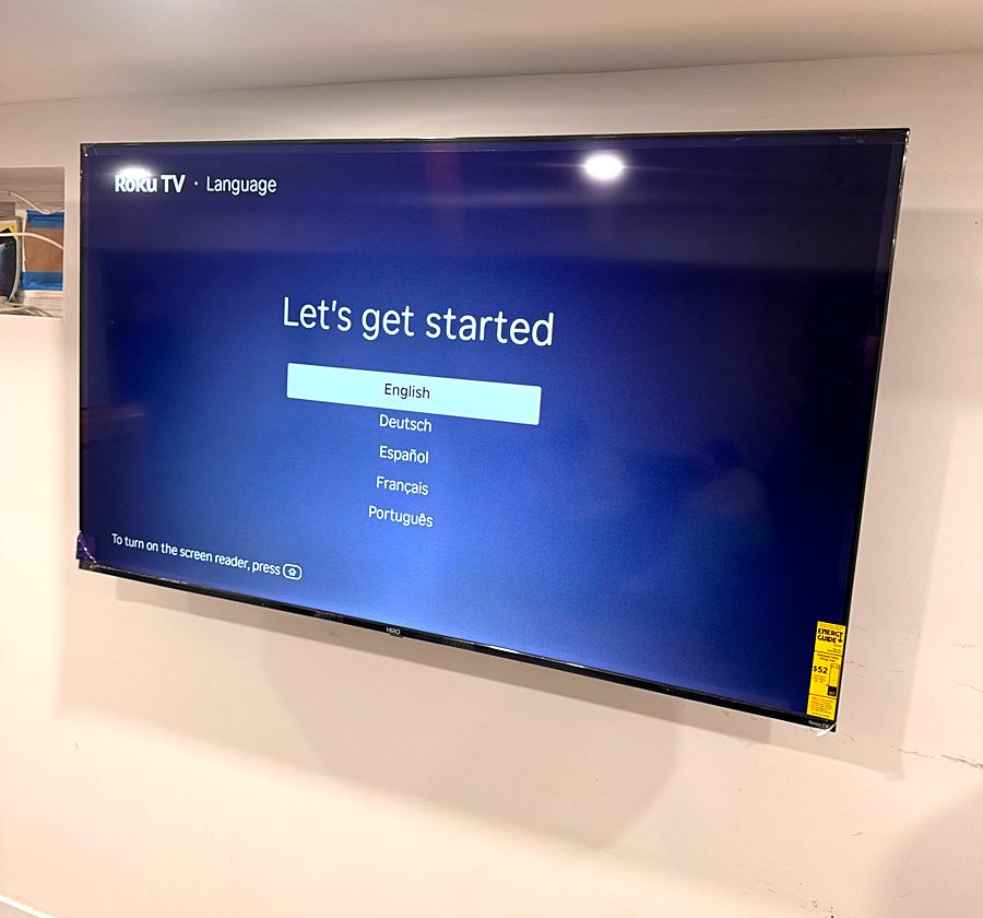 Flat-screen TV mounted on a living room wall